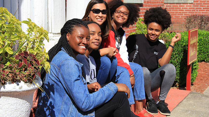 Women of Color sitting on stairs